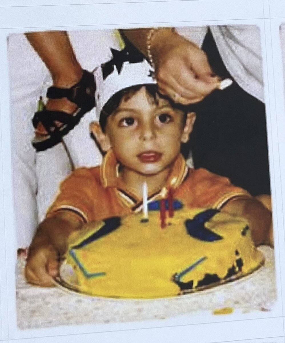 Young Paulie with a birthday cake